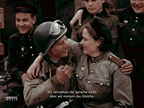 A Group Of Soldiers Are Posing For A Picture And One Of Them Is Wearing A Helmet GIF