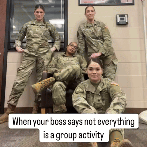 A Group Of Soldiers Are Posing For A Picture With The Caption When Your Boss Says Not Everything Is A Group Activity GIF