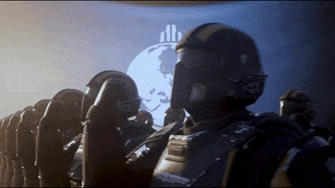A Group Of Soldiers Are Standing In Front Of A Large Screen With A Globe On It GIF