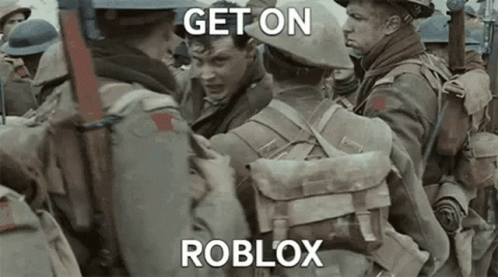 A Group Of Soldiers Are Standing Next To Each Other And One Of Them Is Holding Another Man . GIF