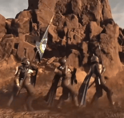 A Group Of Soldiers Carrying A Flag In Front Of A Large Rock Formation GIF
