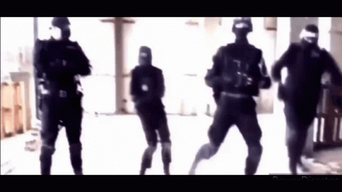 A Group Of Soldiers In Black Uniforms Are Dancing In A Hallway . GIF