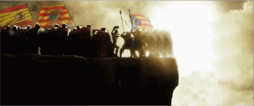A Group Of Soldiers Standing On Top Of A Hill With Flags GIF