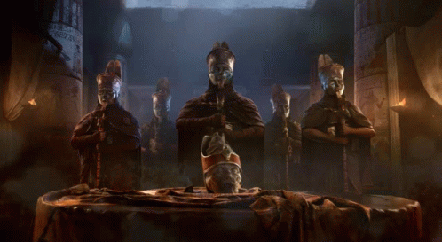 Statues In Dark Room With Central Statue GIF