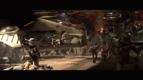 A Group Of Storm Trooper Soldiers Are Standing In Front Of A Destroyed Vehicle GIF