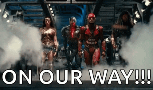 A Group Of Superheroes Standing Next To Each Other With The Words " On Our Way " Written Below Them GIF