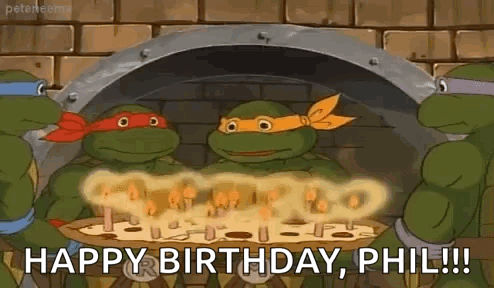 A Group Of Teenage Mutant Ninja Turtles Are Celebrating Their Birthday With A Pizza . GIF