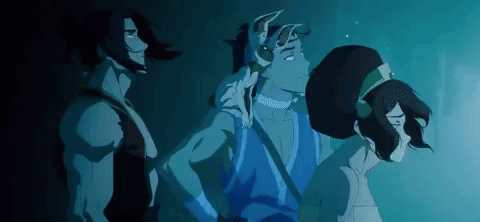 A Group Of Three Cartoon Characters Are Standing Next To Each Other In A Dark Room . GIF