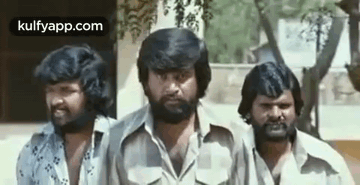 A Group Of Three Men With Beards Are Standing Next To Each Other And Smiling . GIF