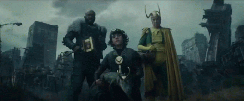 A Group Of Three Superhero Characters Are Standing Next To Each Other In Front Of A City . GIF