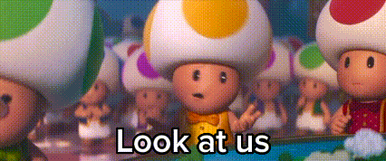 A Group Of Toads Are Standing Next To Each Other With The Words `` Look At Us '' . GIF