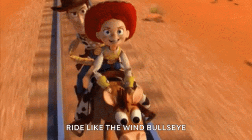 A Group Of Toy Story Characters Are Riding A Roller Coaster . GIF