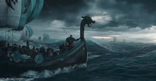A Group Of Vikings Are Riding On The Back Of A Boat In The Ocean . GIF