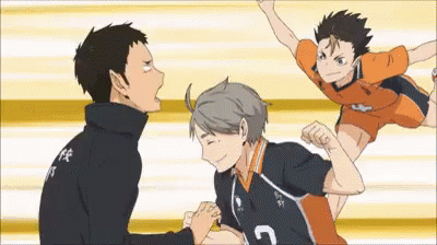 A Group Of Volleyball Players Are Standing Next To Each Other On A Court And One Of Them Is Jumping In The Air . GIF