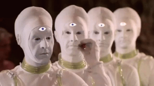 White Three-Eyed Aliens Standing In A Row GIF