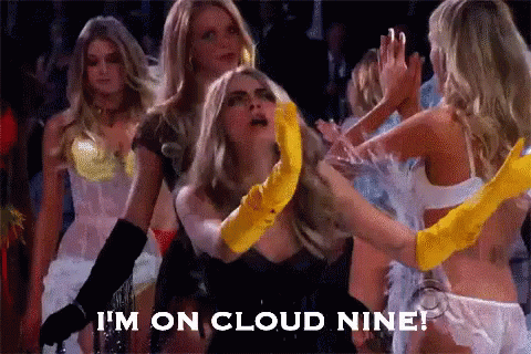 A Group Of Women Are Dancing And One Of Them Is Wearing A Yellow Glove . GIF