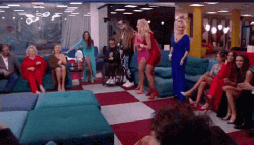 Women Dancing In Living Room With Man In Wheelchair GIF
