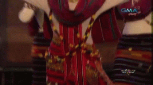 A Group Of Women Are Dancing In A Traditional Costume . GIF