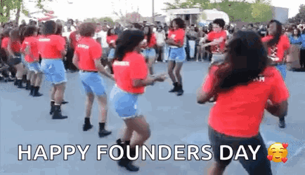 A Group Of Women Are Dancing In Front Of A Crowd . GIF