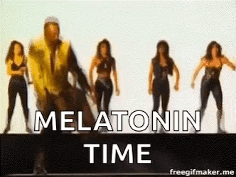 A Group Of Women Are Dancing In Front Of A Man In A Yellow Vest . GIF