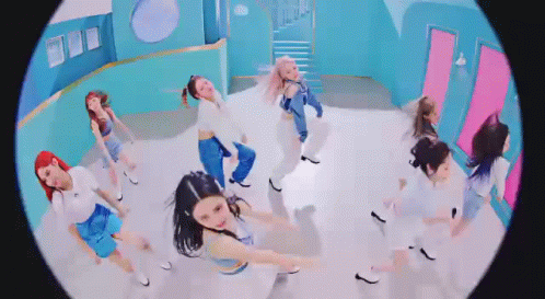 A Group Of Women Are Dancing Together In A Room In A Fisheye Lens . GIF