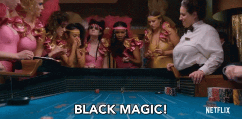 A Group Of Women Are Playing A Game Of Poker And The Words Black Magic Are Visible GIF