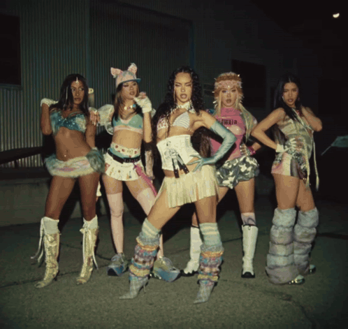 A Group Of Women Are Posing For A Picture And One Of Them Is Wearing A Shirt That Says ' Olivia ' On It GIF