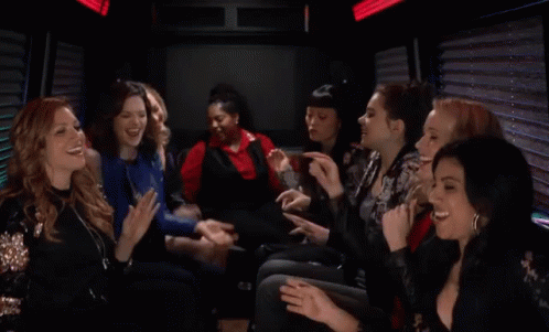 A Group Of Women Are Sitting In A Limo Laughing And Clapping GIF