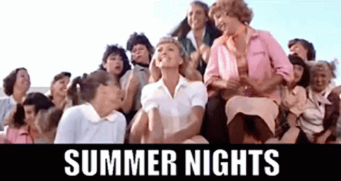 A Group Of Women Are Sitting On Top Of A Bleacher With The Words `` Summer Nights '' Above Them . GIF