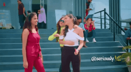 A Group Of Women Are Standing On A Set Of Stairs With The Words @Seriously Below Them GIF
