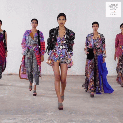 A Group Of Women Are Walking Down A Runway At The Lakme Fashion Week GIF
