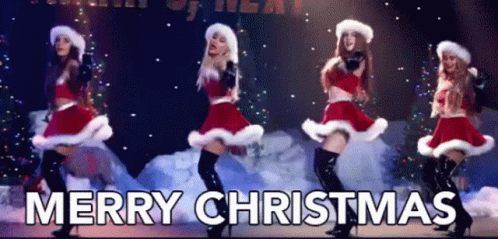 A Group Of Women Dressed As Santa Claus Are Dancing On A Stage And The Words Merry Christmas Are Above Them . GIF