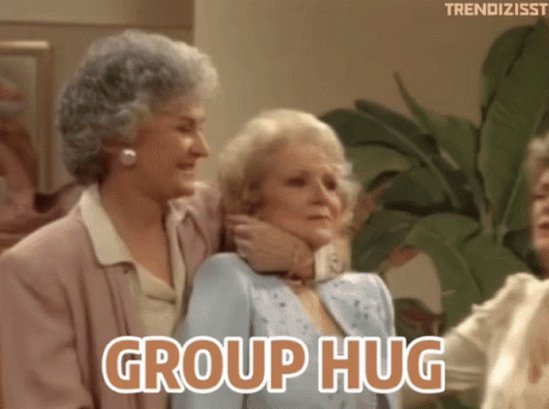 A Group Of Women Hugging Each Other With The Words Group Hug GIF