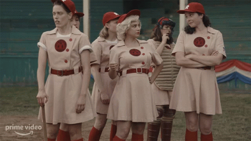 Women In Baseball Uniforms Next To Each Other GIF