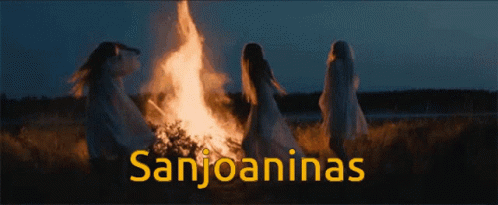 A Group Of Women Standing Around A Fire With The Words Sanjoaninas On The Bottom GIF