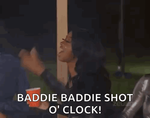 A Group Of Women Standing Next To Each Other Holding Cups And A Sign That Says Baddie Baddie Shot O Clock ! GIF