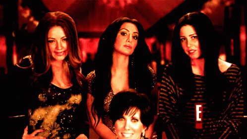 A Group Of Women Standing Next To Each Other With The Letter E On The Bottom GIF