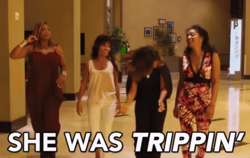 A Group Of Women Walking Down A Hallway With The Words She Was Trippin ' GIF