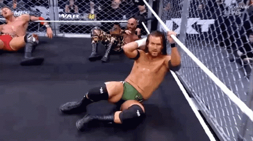 Wrestlers Laying On Ring Floor GIF