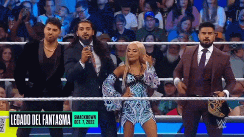 A Group Of Wrestlers Are Standing In A Ring With The Words Legado Del Fantasma On The Bottom GIF
