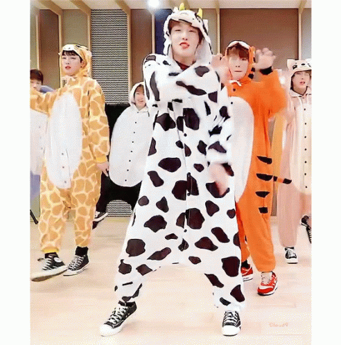 A Group Of Young Boys Are Dressed In Animal Costumes Including A Giraffe And A Tiger GIF
