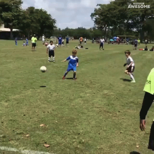 A Group Of Young Boys Are Playing Soccer On A Field With The Words Awesome On The Bottom Right GIF