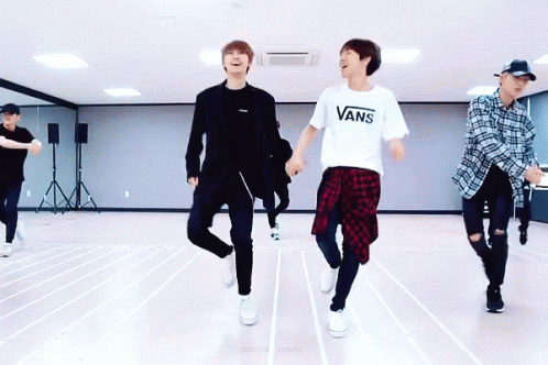 A Group Of Young Men Are Dancing In A Dance Studio And One Of Them Is Wearing A Vans T-Shirt GIF