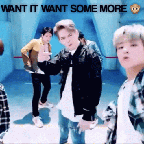 A Group Of Young Men Are Dancing In A Room With The Words Want It Want Some More Written Above Them GIF