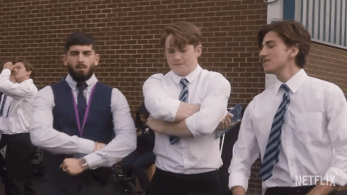 A Group Of Young Men Are Dancing In Front Of A Brick Building And The Word Netflix Is On The Bottom GIF