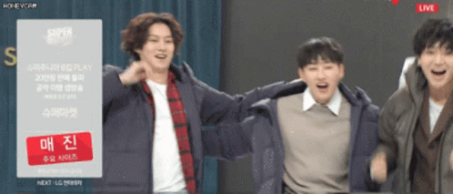 A Group Of Young Men Are Dancing In Front Of A Sign That Says Super Show GIF