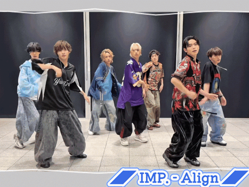 A Group Of Young Men Are Dancing In Front Of A Wall That Says Imp-Align On It GIF