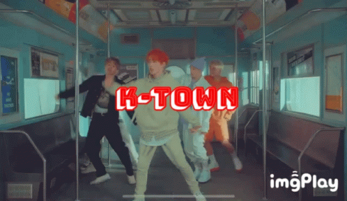 A Group Of Young Men Are Dancing On A Train And The Words K-Town Are Displayed GIF