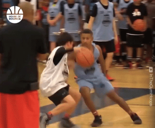 A Group Of Young Men Are Playing Basketball And One Of Them Is Wearing A Jersey That Says ' House Of Bounce ' On It GIF