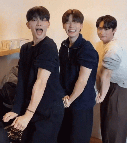 A Group Of Young Men Are Posing For A Picture And One Of Them Has A Bracelet On His Wrist GIF